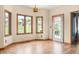 Living area featuring wood floor, multiple windows, and trim accents at 7082 Hunters Ridge Dr, Plainfield, IN 46168