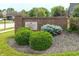 Hunters Ridge community sign in a brick facade and lush green shrubbery at 7082 Hunters Ridge Dr, Plainfield, IN 46168