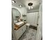 Stylish bathroom featuring a modern vanity with wood countertop and decorative black and white tile floors at 7195 W 700 N, Fairland, IN 46126