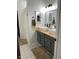 Brightly lit bathroom featuring double sinks and patterned tile floors at 7195 W 700 N, Fairland, IN 46126