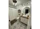 Charming bathroom featuring black and white tile floors, a modern vanity, and a decorative shower curtain at 7195 W 700 N, Fairland, IN 46126