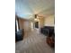 Neutral bedroom featuring a ceiling fan, gray crib, and neutral carpeting at 7195 W 700 N, Fairland, IN 46126