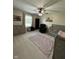 A Bedroom is furnished with a crib, dresser, recliner, and ceiling fan at 7195 W 700 N, Fairland, IN 46126