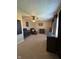 Cozy carpeted bedroom featuring a ceiling fan, crib, changing table and neutral decor at 7195 W 700 N, Fairland, IN 46126