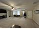 Expansive carpeted bonus room with an entertainment center and a home office space at 7195 W 700 N, Fairland, IN 46126