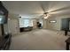 Spacious carpeted bonus room with a desk area, entertainment center, and seating at 7195 W 700 N, Fairland, IN 46126