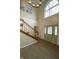Inviting foyer with hardwood floors, staircase, shiplap accent walls and natural light from a large arched window at 7195 W 700 N, Fairland, IN 46126