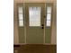 Charming front door with sidelights and decorative glass panels at 7195 W 700 N, Fairland, IN 46126