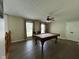 Spacious game room with pool table, ceiling fan, and hardwood floors at 7195 W 700 N, Fairland, IN 46126