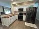Charming kitchen with white cabinetry, black appliances, and wood countertops at 7195 W 700 N, Fairland, IN 46126