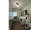 A laundry room with a folding table, washer, dryer, and water heater at 7195 W 700 N, Fairland, IN 46126