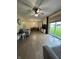 Open living room with wood floors, neutral decor, and backyard views at 7195 W 700 N, Fairland, IN 46126