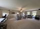 Expansive living room featuring a workstation, comfortable seating, and a ceiling fan at 7195 W 700 N, Fairland, IN 46126