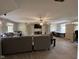 Spacious living room featuring neutral-colored furniture, a ceiling fan, and built-in shelves at 7195 W 700 N, Fairland, IN 46126