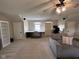 Large living room and a workspace with desk, bookshelves, and office chair at 7195 W 700 N, Fairland, IN 46126