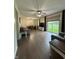 Spacious living room featuring wood floors, an open layout, and a sliding door to outside at 7195 W 700 N, Fairland, IN 46126