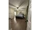 Spacious main bedroom with wood floors and a ceiling fan at 7195 W 700 N, Fairland, IN 46126