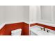 Powder room with a red wainscot at 753 Walnut St, Franklin, IN 46131