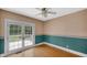 Bright bedroom with French doors leading to a balcony and hardwood floors at 753 Walnut St, Franklin, IN 46131
