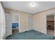Bedroom with two open doors: one to the bathroom and one to a den at 753 Walnut St, Franklin, IN 46131