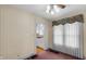 Light-filled dining room with classic wallpaper, plush carpet and a glimpse of the kitchen at 753 Walnut St, Franklin, IN 46131