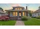 Charming bungalow-style home with brick accents, landscaped yard, and a cozy front porch at 753 Walnut St, Franklin, IN 46131
