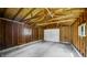 Spacious garage featuring a concrete floor, exposed wood frame, and natural light at 753 Walnut St, Franklin, IN 46131