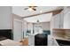 Spacious kitchen with a gas cooktop, white cabinetry, and hardwood floors at 753 Walnut St, Franklin, IN 46131