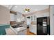 Bright kitchen featuring white cabinetry, a black gas cooktop, and modern appliances at 753 Walnut St, Franklin, IN 46131