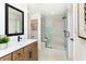Bathroom featuring a double vanity and tiled glass enclosed shower with a built-in bench at 7601 Bluegill Dr, Noblesville, IN 46062