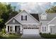 Charming two-story home with stone accents and a covered front porch providing curb appeal at 7601 Bluegill Dr, Noblesville, IN 46062