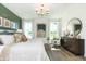 Bright and airy main bedroom with hardwood floors, large windows, and comfortable seating at 7601 Bluegill Dr, Noblesville, IN 46062