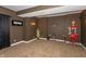 Finished basement area, great for entertaining, featuring an electric fireplace and popcorn machine at 7818 Fawnwood Dr, Indianapolis, IN 46278