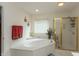 Bright bathroom with jacuzzi tub and shower at 7818 Fawnwood Dr, Indianapolis, IN 46278