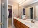 Bathroom featuring double sinks, lots of counter space and storage beneath at 7818 Fawnwood Dr, Indianapolis, IN 46278