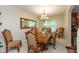 Elegant dining room with a large table, ornate chairs, and stylish lighting at 7818 Fawnwood Dr, Indianapolis, IN 46278