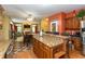 Open-concept kitchen with granite countertops and stainless steel appliances overlooking the dining and living room at 7818 Fawnwood Dr, Indianapolis, IN 46278
