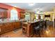 Well-appointed kitchen with wood cabinetry, breakfast bar, and hardwood floors at 7818 Fawnwood Dr, Indianapolis, IN 46278