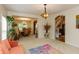 Open-concept living area flowing into dining, adorned with plants and elegant furnishings at 7818 Fawnwood Dr, Indianapolis, IN 46278