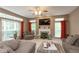 Bright living room with fireplace and view to the backyard at 7818 Fawnwood Dr, Indianapolis, IN 46278