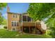 Exterior of the home featuring a multi-tiered deck and lush backyard at 7818 Fawnwood Dr, Indianapolis, IN 46278