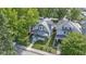Aerial view of a charming home with a well-manicured lawn and inviting front porch at 909 N Parker Ave, Indianapolis, IN 46201