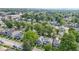An aerial view of the neighborhood, displaying mature trees and houses at 909 N Parker Ave, Indianapolis, IN 46201