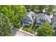 Aerial view of a charming home with a well-manicured lawn and inviting front porch at 909 N Parker Ave, Indianapolis, IN 46201