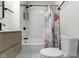 This is a bathroom with a tub shower and updated vanity at 909 N Parker Ave, Indianapolis, IN 46201