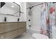 This is a full bathroom with a tub shower and updated vanity at 909 N Parker Ave, Indianapolis, IN 46201