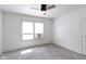 Bedroom features a ceiling fan and window for plenty of natural light at 909 N Parker Ave, Indianapolis, IN 46201
