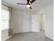 The bedroom has a ceiling fan, closet, and doorway into the hall at 909 N Parker Ave, Indianapolis, IN 46201