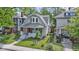 Charming two-story home with a well-manicured lawn and a real estate sign at 909 N Parker Ave, Indianapolis, IN 46201