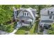 Charming home with a well-manicured lawn and a real estate sign at 909 N Parker Ave, Indianapolis, IN 46201